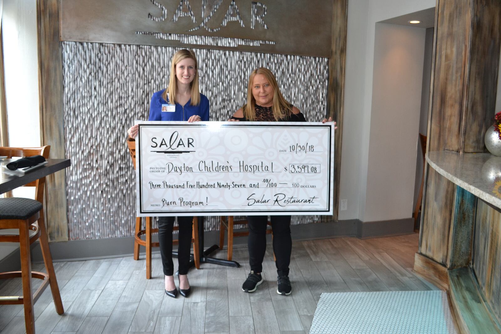 Salar Restaurant and Lounge, 400 E. Fifth St. in Dayton’s Oregon District, has donated $3,600 to Dayton Children’s Hospital Burn Program.