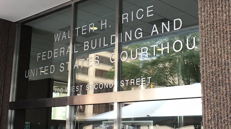 The front windows greeting visitors at the newly named Walter H. Rice Federal Building and U.S. Courthouse downtown. THOMAS GNAU/STAFF