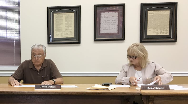 Perry Twp. trustees Gerald Peters, left, and Sheila Stanifer both voted to place new continuous police and fire/EMS levies on the November ballot. The township trustees President Dale Seim was absent. CHRIS STEWART / STAFF