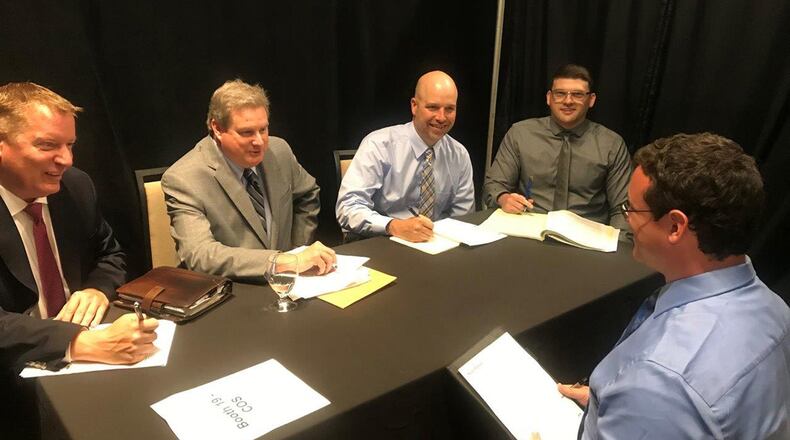 Left to right: David McCain, Patrick Dolan, Health Morton and Jacob Miracle interview potential candidate Sean Patrick at the Air Force Life Cycle Management Center hiring event May 29 at the Marriot Hotel in Dayton. Patrick is currently a contractor at AFLCMC/HI and is seeking employment in cyber security. (U.S. Air Force photos/Stacey Geiger)
