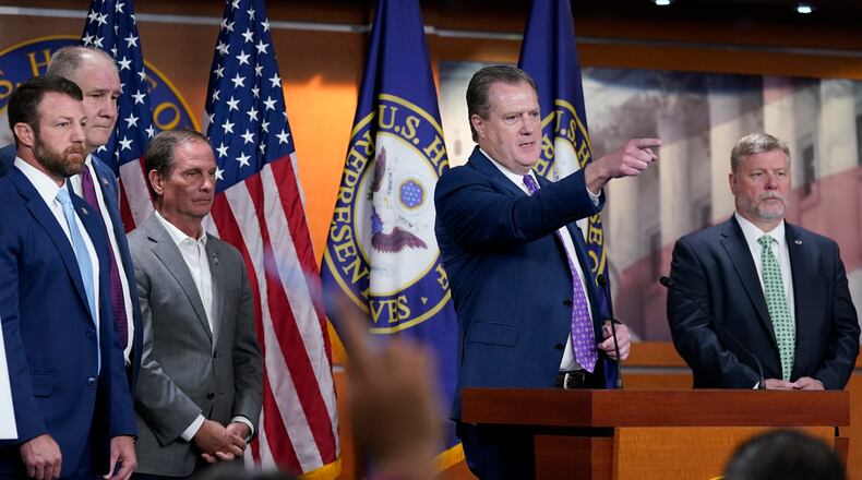 House Intelligence Committee ranking member Rep. Mike Turner, R-Dayton, second from right, joined by other Republicans on the committee, calls on a reporter during a news conference on Capitol Hill in Washington, Friday, Aug. 12, 2022, on the FBI serving a search warrant at former President Donald Trump's home in Florida. (AP Photo/Susan Walsh)
