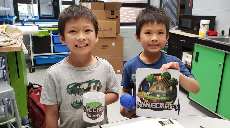 Children create a Minecraft mug and sign via the new Creativity Commons inside Washington Twp. RecPlex on Thursday, June 16, 2022. The makerspace initiative is powered by Washington Twp.-Centerville Public Library and takes place in 800 square feet of leased space within the RecPlex. CONTRIBUTED