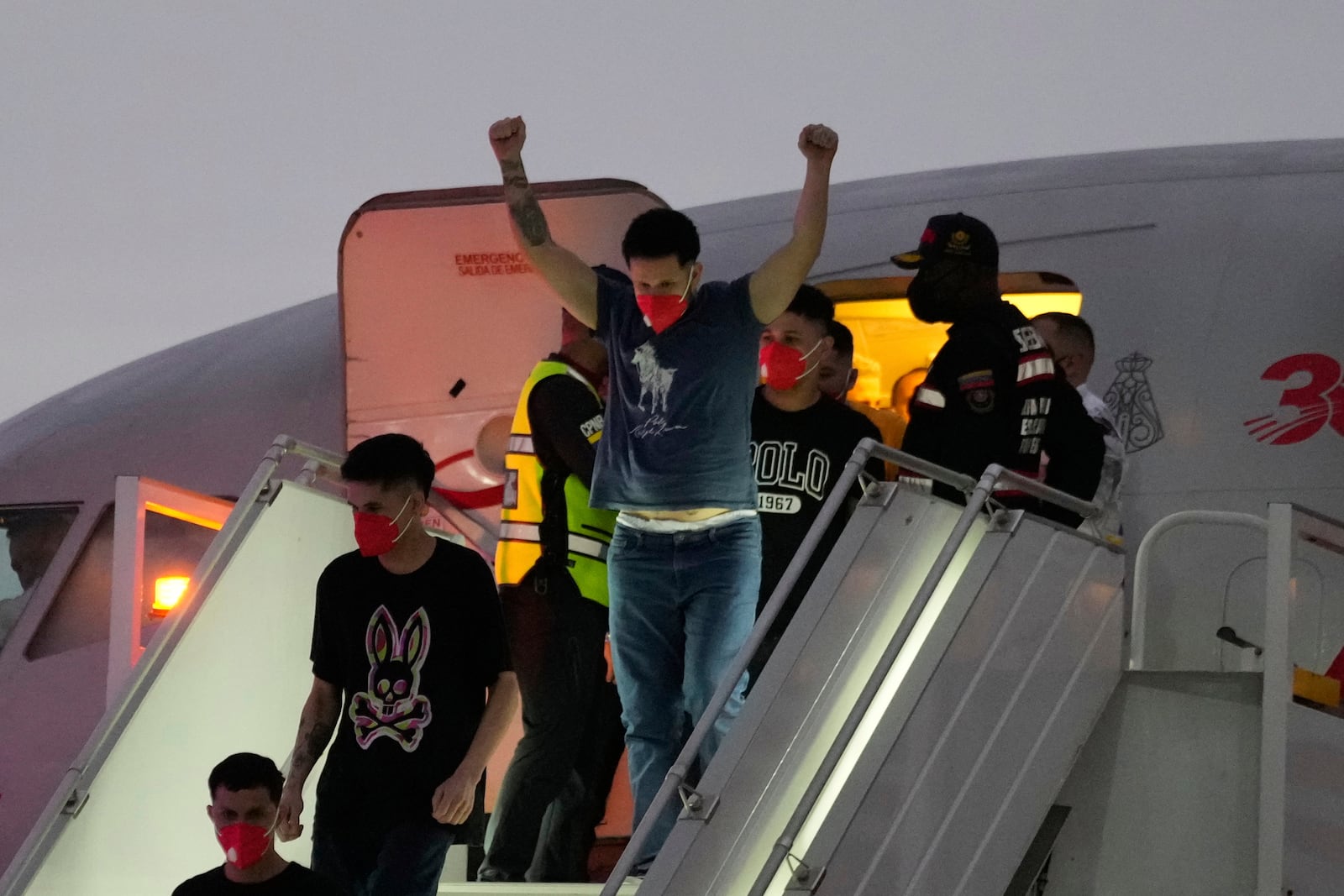 Migrants deported months ago by the United States to El Salvador under the Trump administration's immigration crackdown arrive at Simon Bolívar International Airport in Maiquetia, Venezuela, Friday, July 18, 2025. (AP Photo/Ariana Cubillos)