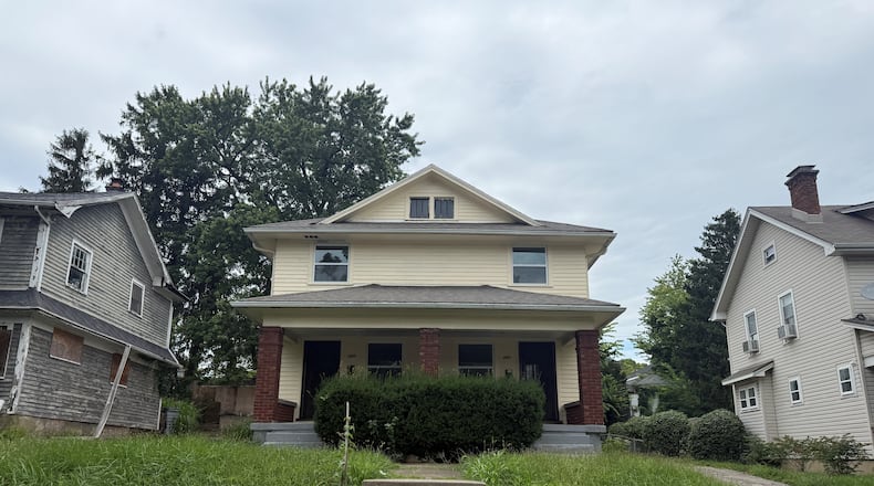 The city of Dayton issued a civil penalty warning to this home for alleged housing code violations. CORNELIUS FROLIK / STAFF