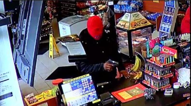 Surveillance footage shows an armed robbery at a Miamisburg Shell Station.