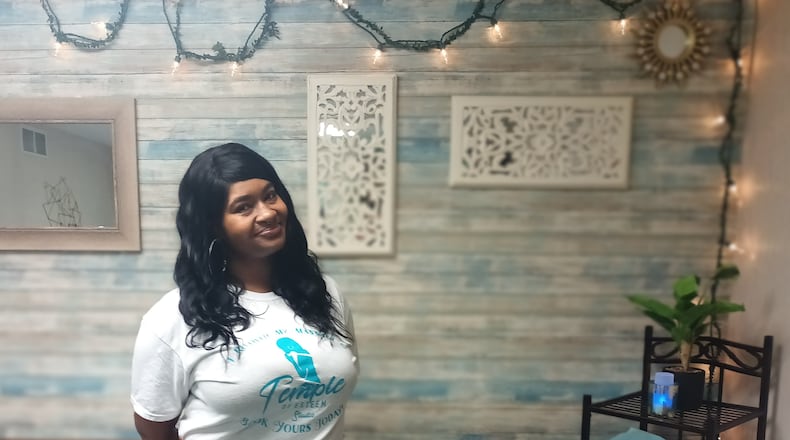 Stacy Harden, a massage therapist, is the owner and operator of Stacy’s Temple of Esteem Studio, located at 109 White Allen Ave. in Dayton. SAMANTHA WILDOW\STAFF