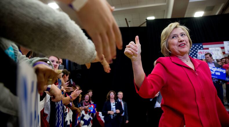 Democratic presidential candidate Hillary Clinton, center, arrives to speak at a get out the vote event at Transylvania University in Lexington, Ky., Monday, May 16, 2016. (AP Photo/Andrew Harnik)