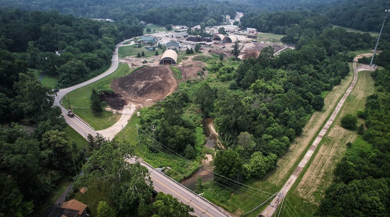 Sugar Creek runs on the north end of Tom's Mulch property. The state of Ohio is suing the Bellbrook landscaping company over alleged polluting of Sugar Creek. JIM NOELKER/STAFF