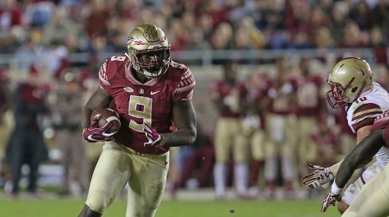 FILE - This Nov. 11, 2016 photo shows Florida State’s Jacques Patrick looking for running room against Boston College’s defense in an NCAA college football game in Tallahassee, Fla. After two years of being behind Dalvin Cook on the depth chart, Jacques Patrick is ready to take the lessons he learned from watching Cook and become Florida State’s lead running back this season. (AP Photo/Steve Cannon)