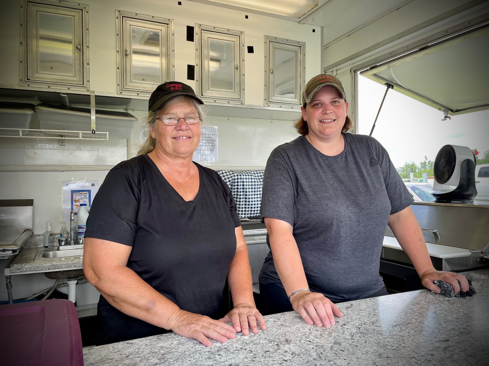 Jamie Henry (right), has owned Grumpy's BBQ with her mom, Kim Blackford, since 2017. NATALIE JONES/STAFF