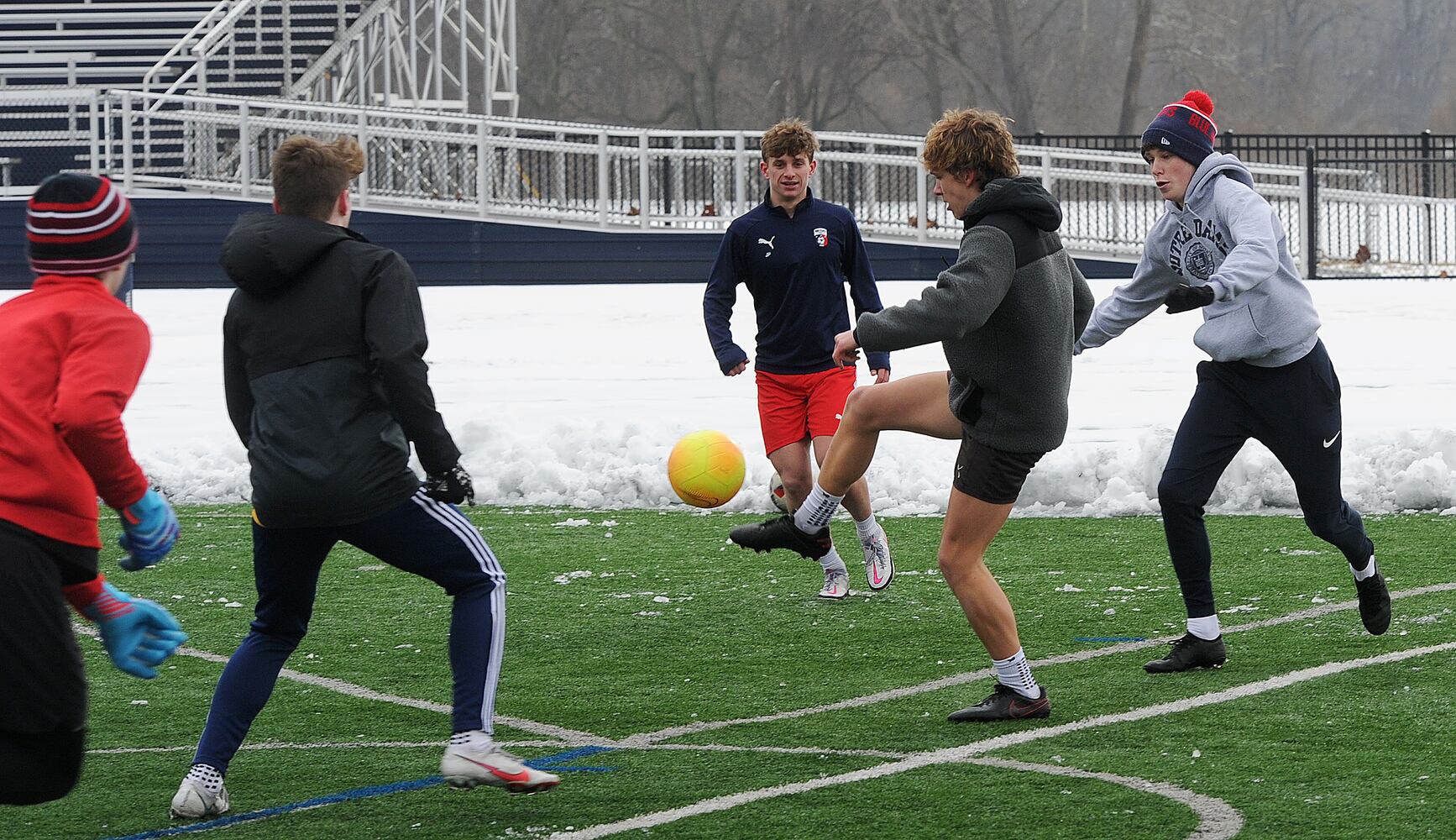 PHOTOS: Oakwood soccer players shovel snow to play