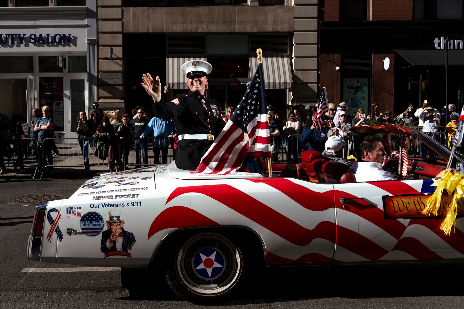FILE - Grand Marshal Dakota Meyer, U.S. Marine Corps, a Medal of Honor recipient, waves from a car during the annual Veterans Day Parade, Nov. 11, 2024, in New York. (AP Photo/Adam Gray, File)