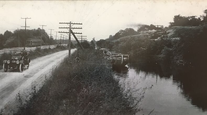 This photos in Miamisburg shows five modes of transportation in use in the 1800s. The waterway in the photo is Miami-Erie Canal. MIAMISBURG HISTORICAL SOCIETY PHOTO