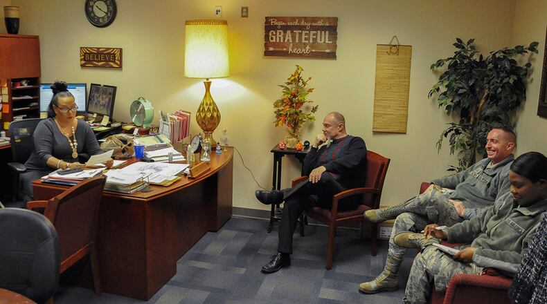 Employees at the Equal Opportunity office at Wright-Patterson Air Force Base gather for a staff meeting, Feb. 19. The Equal Opportunity office’s mission is to eradicate unlawful discrimination and to sustain Air Force policy to provide equitable opportunities to the workforce and secure a discrimination-free workplace. (U.S. Air Force photo/Loren Deer)