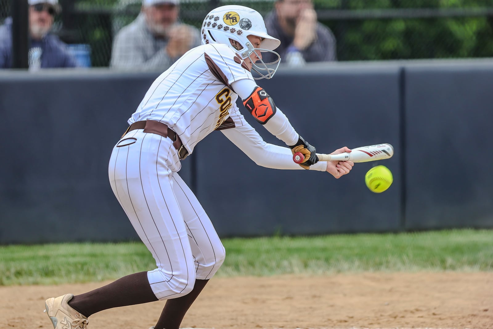 Kenton Ridge High School sophomore Chloe Glass attempts to lay down a bunt during their Division IV district final game against CHCA on Friday, May 23 at Valley View High School. The Cougars won 11-0. MICHAEL COOPER / STAFF