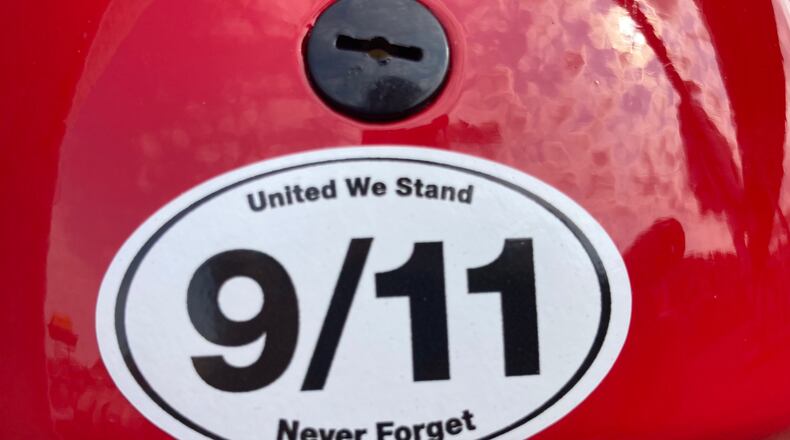Dayton football players wore 9/11 patches on their helmets on Saturday, Sept. 11, 2021, during a game against Eastern Illinois at Welcome Stadium. David Jablonski/Staff