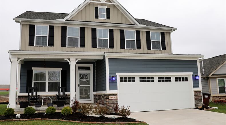 The fiber-board-and-stone house has about 2,420 sq. ft. of living space plus a finished basement. Located within the Cedar Grove subdivision and built in 2018, the home has a front-covered porch and a 2-car garage. CONTRIBUTED PHOTO BY KATHY TYLER