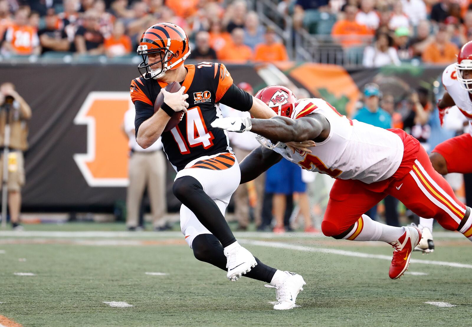 CINCINNATI, OH - AUGUST 19: Andy Dalton #14 of the Cincinnati Bengals is sacked by Allen Bailey #97 of the Kansas City Chiefs during the preseason game at Paul Brown Stadium on August 19, 2017 in Cincinnati, Ohio. (Photo by Andy Lyons/Getty Images)