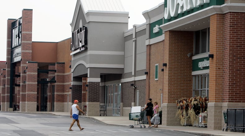 FILE - People walk into and out of a Joann store, Sept. 6, 2007, in Garfield Heights, Ohio. The fabric and crafts retailer has filed for Chapter 11 bankruptcy protection, as consumers continue to cut back on discretionary spending. In a Monday, March 18, 2024 release, the Hudson, Ohio-based company said that it expected to emerge from bankruptcy as early as the end of next month. (AP Photo/Tony Dejak, file)