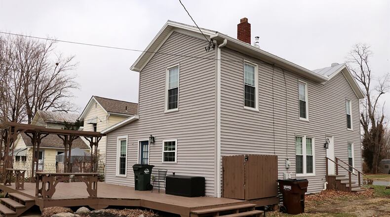 The remodeled kitchen with breakfast room opens to a rear deck and open back yard. The property includes a barn with a 1-car overhead door, workshop and storage.