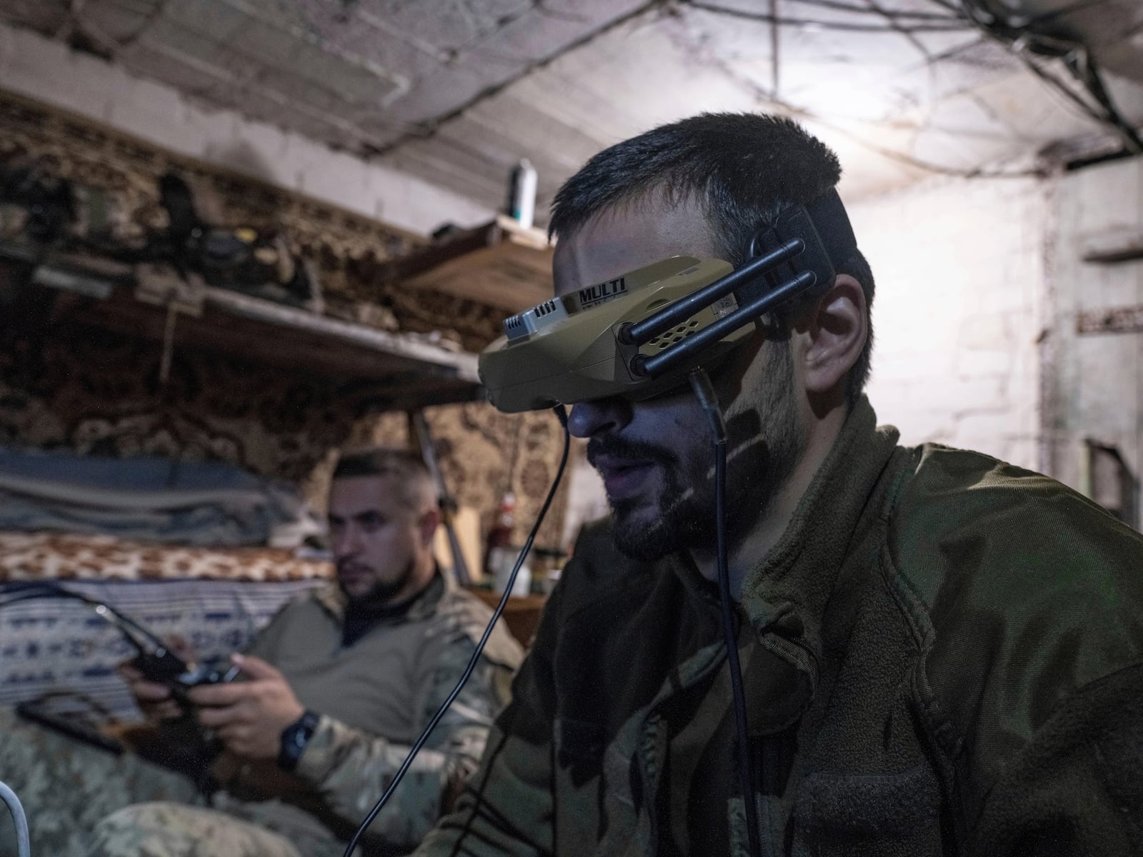 FILE - In this photo provided by Ukraine's 93rd Kholodnyi Yar Separate Mechanized Brigade press service, soldiers use drones to fire on Russian positions from a shelter in Kostyantynivka, Donetsk region, Ukraine, on May 23, 2025. (Iryna Rybakova/Ukraine's 93rd Mechanized Brigade via AP, File)