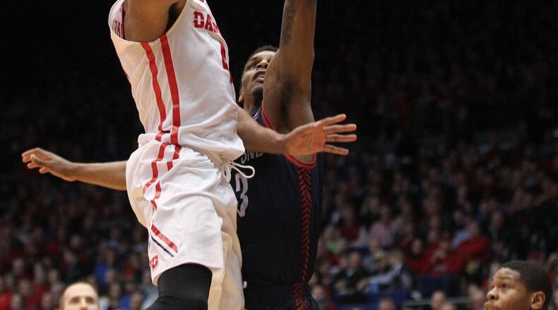 Dayton’s Charles Cooke scores against Duquesne on Tuesday, Feb. 9, 2016, at UD Arena in Dayton. David Jablonski/Staff
