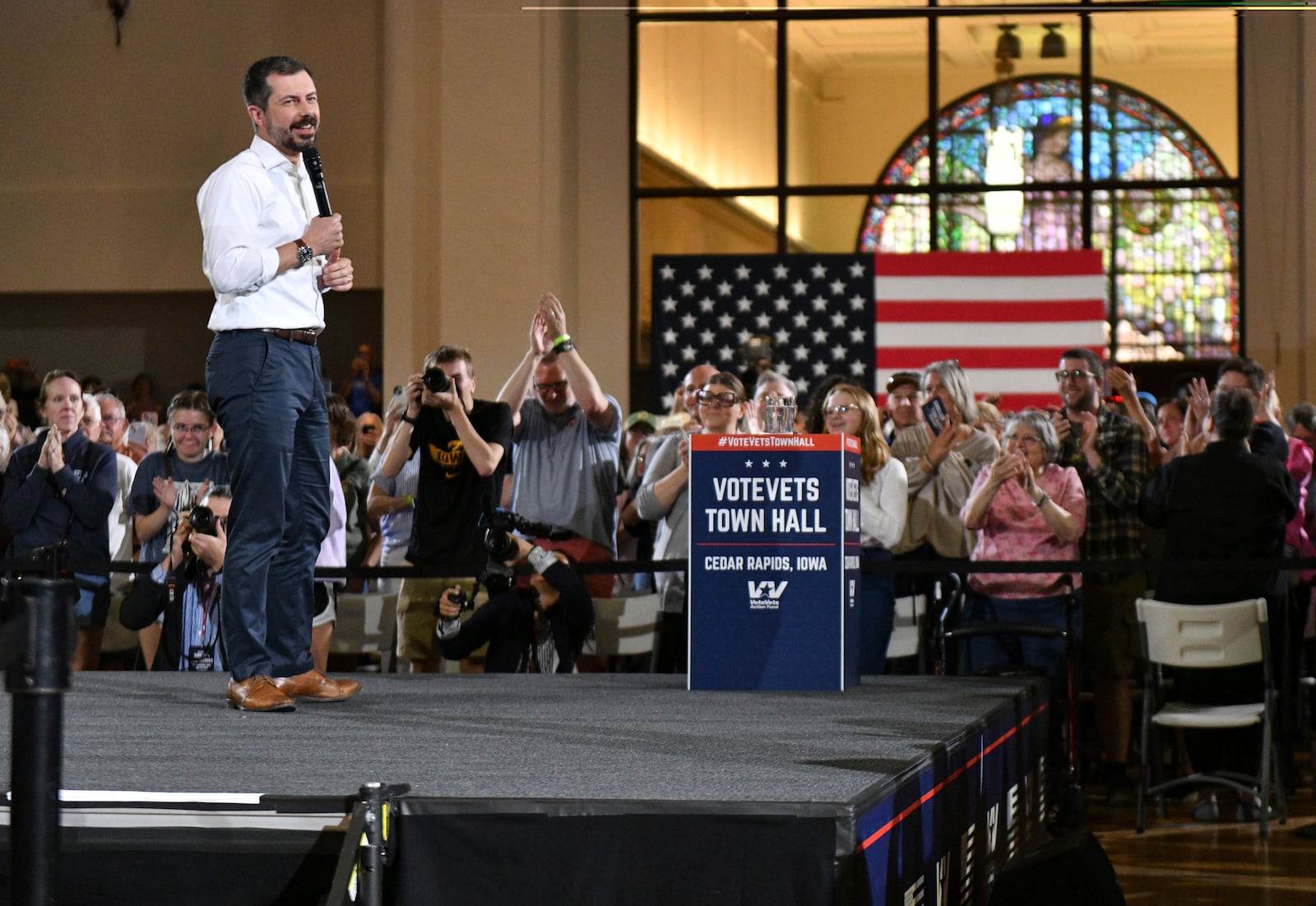 Pete Buttigieg, former transportation secretary, takes the stage during a VoteVets town hall, in Cedar Rapids, Iowa, Tuesday, May 13, 2025. (AP Photo/Cliff Jette)