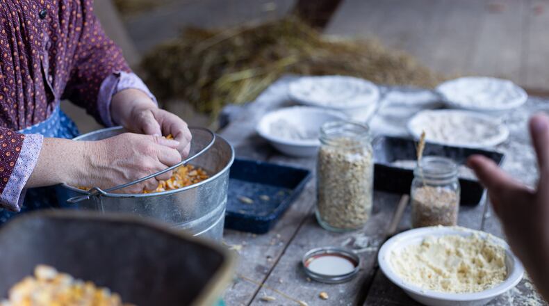 A family enjoying a live food demonstration at Small Farm and Food Fest.