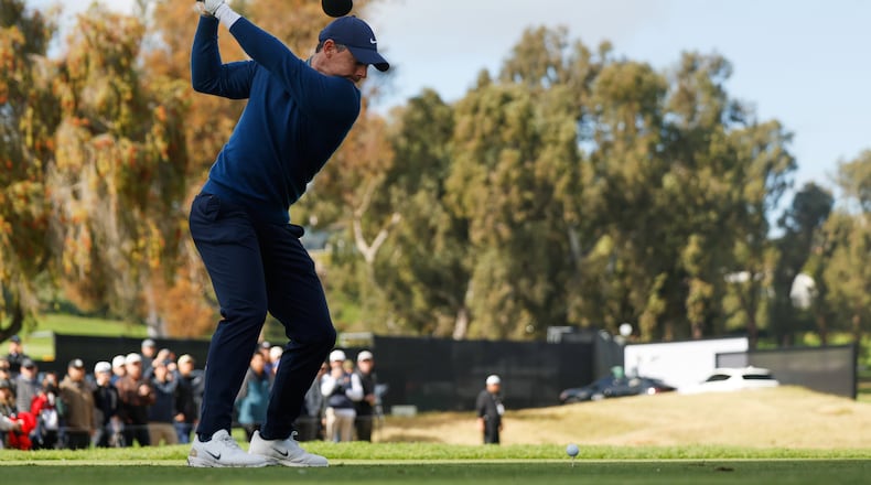 Rory McIlroy, from Northern Ireland, hits from the ninth tee during the first round of the Genesis Invitational golf tournament at Riviera Country Club, Thursday, Feb. 19, 2026, in the Pacific Palisades area of Los Angeles. (AP Photo/Caroline Brehman )