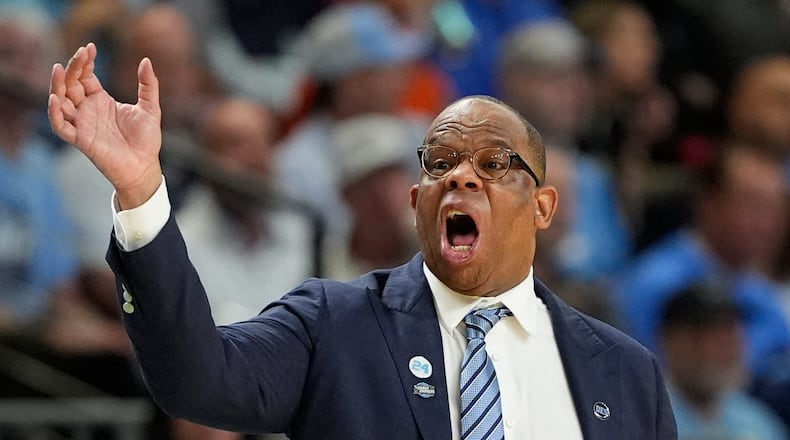 North Carolina head coach Hubert Davis yells during the second half against VCU in the first round of the NCAA college basketball tournament, Thursday, March 19, 2026, in Greenville, S.C. (AP Photo/Chris Carlson)