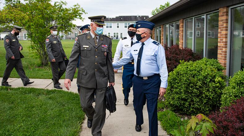 Col. Sasa Milutinovic (left), head of religious services for the Serbian armed forces, and Col. Kim Bowen, 88th Air Base Wing chaplain, chat as they enter Prairies Chapel Community Center at Wright-Patterson Air Force Base on May 11. Milutinovic, along with four other Serbian chaplains, visited the base with Army Col. Daniel Burris, Ohio National Guard state chaplain, and others in the Ohio chaplain delegation. U.S. AIR FORCE PHOTO/WESLEY FARNSWORTH