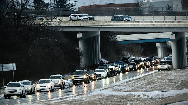 Icy roads on Interstate 675 near Fairborn caused several crashes and slide offs. Most of the Dayton area was covered in ice, causing several accidents all throughout the area Tuesday, March 14, 2023. MARSHALL GORBY \STAFF
