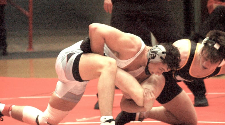 Joey Sanchez works on finishing off a takedown during his win against St. Edward in the OHSAA state team tournament finals. Graham won the D-I title 28-23 over the Eagles Sunday at St. John’s Arena. John Cummings/CONTRIBUTED