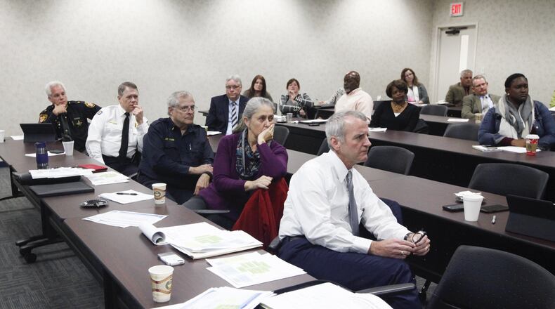 The steering committee implementing a Community Overdose Action Team meets in November 2016 in response to the heroin crisis. CHRIS STEWART / STAFF