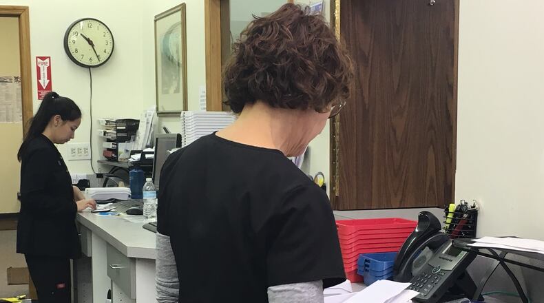 Staff work to fill prescriptions at Waynesville Pharmacy. KATIE WEDELL/STAFF