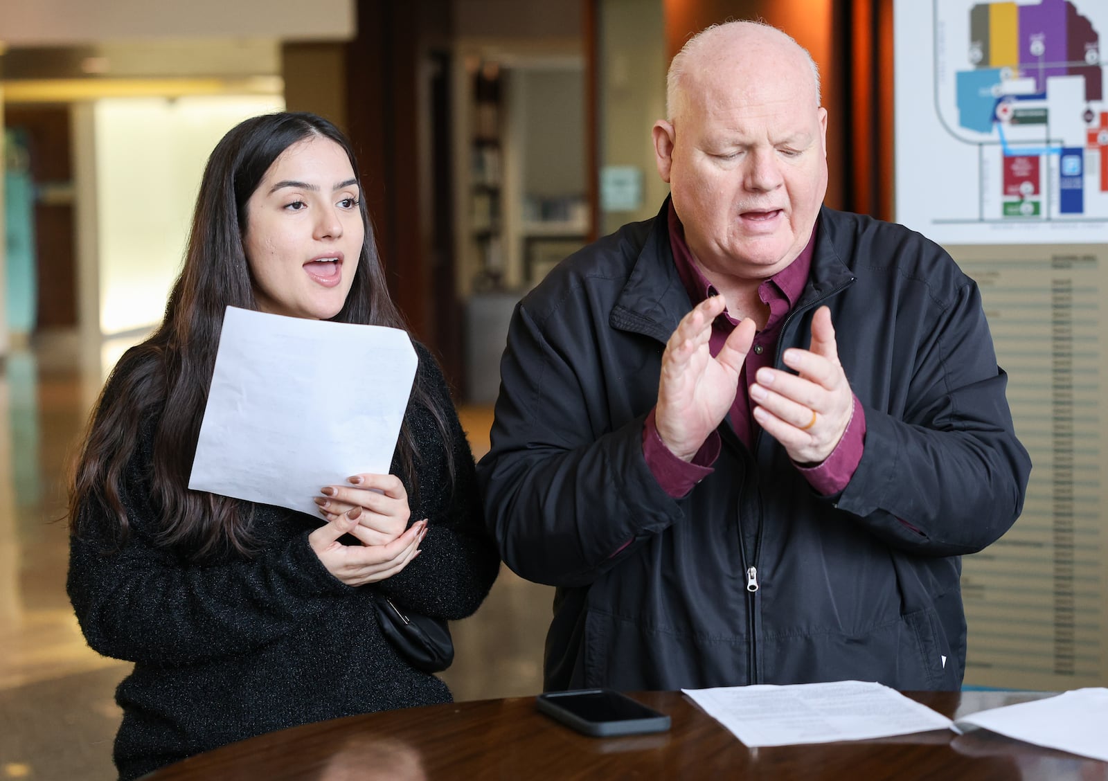 Scott Davidson (right) and his daughter Hannah sing on Monday, Dec. 22 at Miami Valley Hospital. Davidson, who is the pastor at Soul Winners for Jesus Christ on South Main Street, organized a group that sang traveled to Miami Valley Hospital North and South on Monday, as well as the main campus in Dayton. Davidson underwent multiple surgeries in October. BRYANT BILLING/STAFF
