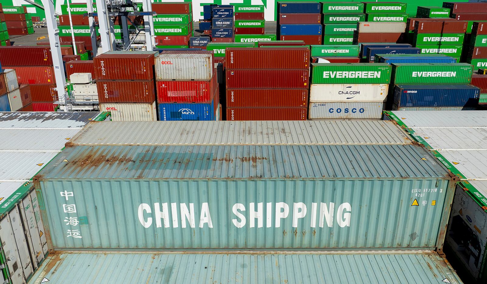 Cargo containers line a shipping terminal at the Port of Oakland on Thursday, April 3, 2025, in Oakland, Calif. (AP Photo/Noah Berger)