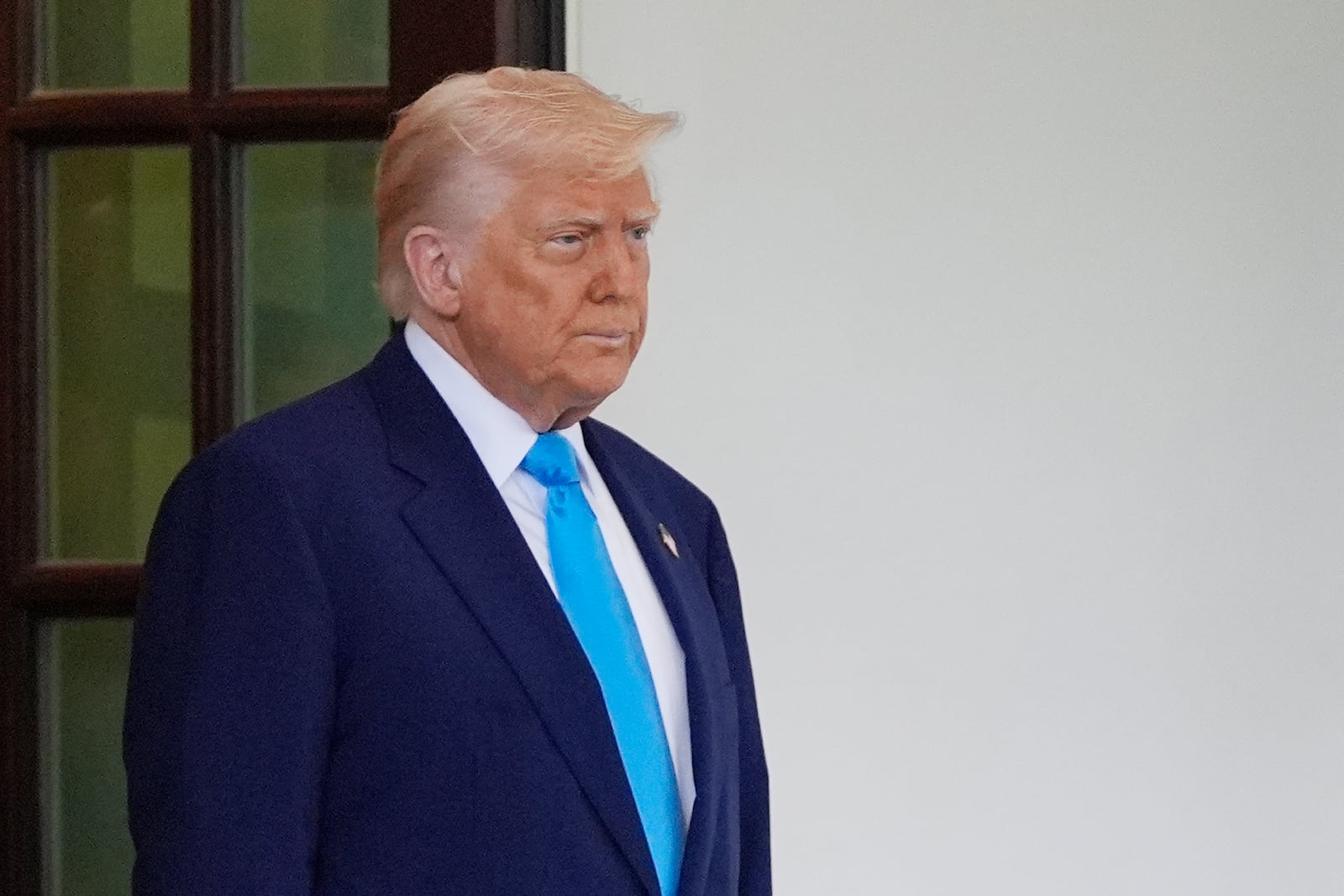 President Donald Trump waits to greet South African President Cyril Ramaphosa at the White House, Wednesday, May 21, 2025, in Washington. (AP Photo/Julia Demaree Nikhinson)
