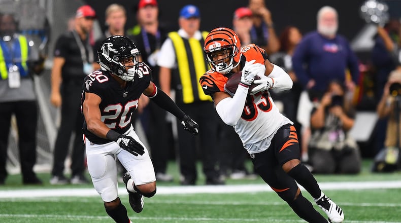 ATLANTA, GA - SEPTEMBER 30: Tyler Boyd #83 of the Cincinnati Bengals runs past Isaiah Oliver #20 of the Atlanta Falcons during the third quarter at Mercedes-Benz Stadium on September 30, 2018 in Atlanta, Georgia. (Photo by Scott Cunningham/Getty Images)