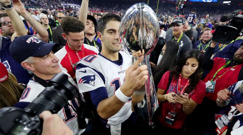 HOUSTON, TX - FEBRUARY 05:  Jimmy Garoppolo #10 of the New England Patriots holds the Vince Lombardi Trophy after defeating the Atlanta Falcons 34-28 in overtime during Super Bowl 51 at NRG Stadium on February 5, 2017 in Houston, Texas.  (Photo by Tom Pennington/Getty Images)