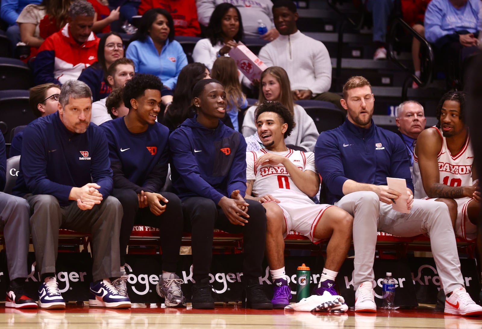 Dayton players on the bench, including Adam Njie Jr., third from left, watch the game against North Carolina Central on Saturday, Nov. 22, 2025, at UD Arena. David Jablonski/Staff