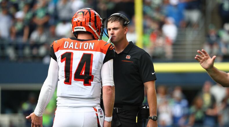 SEATTLE, WASHINGTON - SEPTEMBER 08: Andy Dalton #14 and head coach Zac Taylor of the Cincinnati Bengals have a conversation in the fourth quarter during their game against the Seattle Seahawks at CenturyLink Field on September 08, 2019 in Seattle, Washington. (Photo by Abbie Parr/Getty Images)