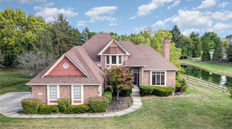 This brick two story sits on a half acre wooded corner lot next to a duck pond. It is in the Centerville City School District. CONTRIBUTED
