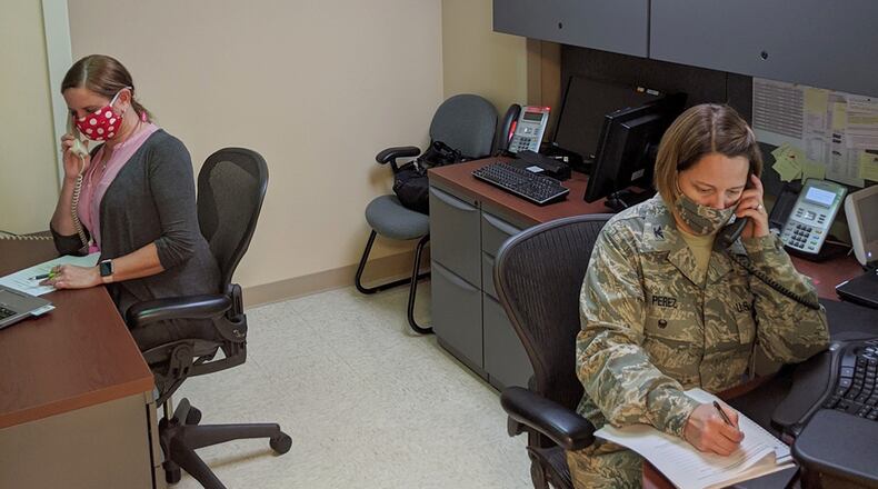Col. Heather Perez (left) and nurse Lisa Parsons work Aug. 4 to trace contacts of individuals who have been identified as COVID-19 positive. They support the 88th Medical Group’s Public Health Flight at Wright-Patterson Air Force Base. (U.S. Air Force photo/Capt. Stephanie Croyle)