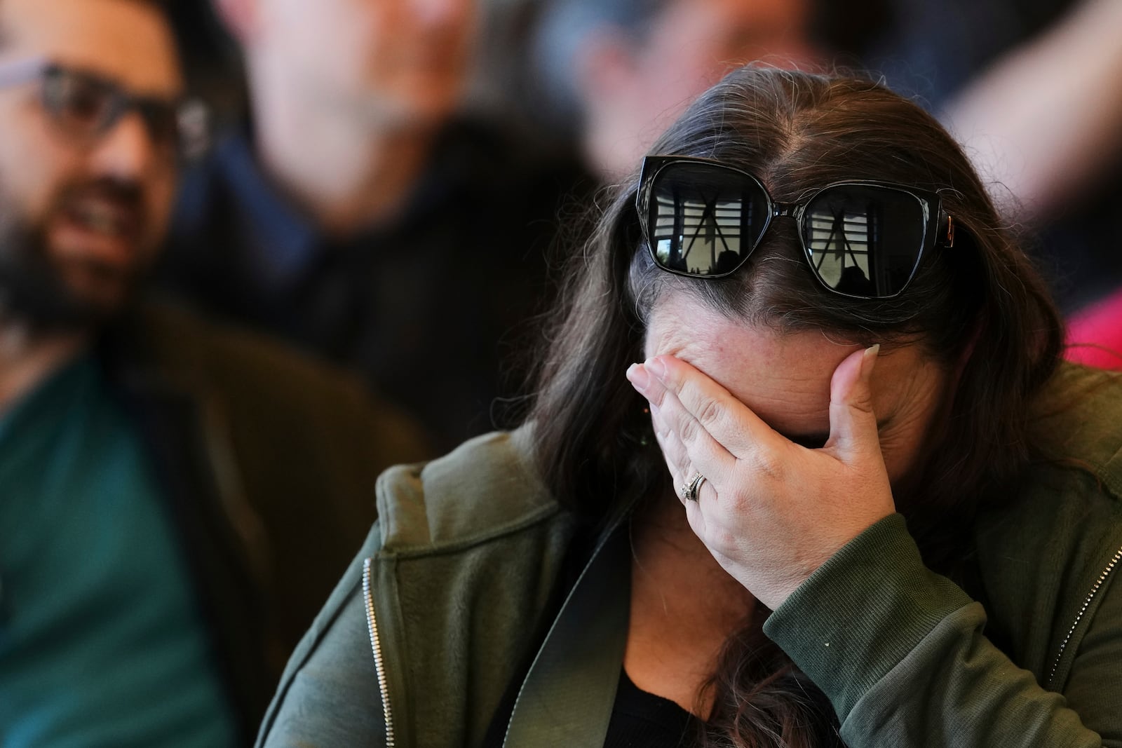 An attendee reacts during a town hall event with Rep. Marie Gluesenkamp Perez, D-Wash., at Centralia College Tuesday, April 22, 2025, in Centralia, Wash. (AP Photo/Lindsey Wasson)