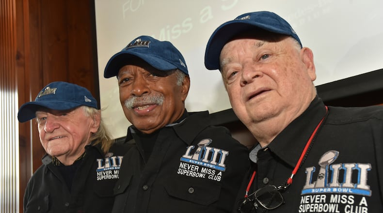 FILE — Members of the Never Miss a Super Bowl Club, from the left, Tom Henschel, Gregory Eaton, and Don Crisman pose for a group photograph during a welcome luncheon, in Atlanta, Feb. 1, 2019. (Hyosub Shin/Atlanta Journal-Constitution via AP, File)