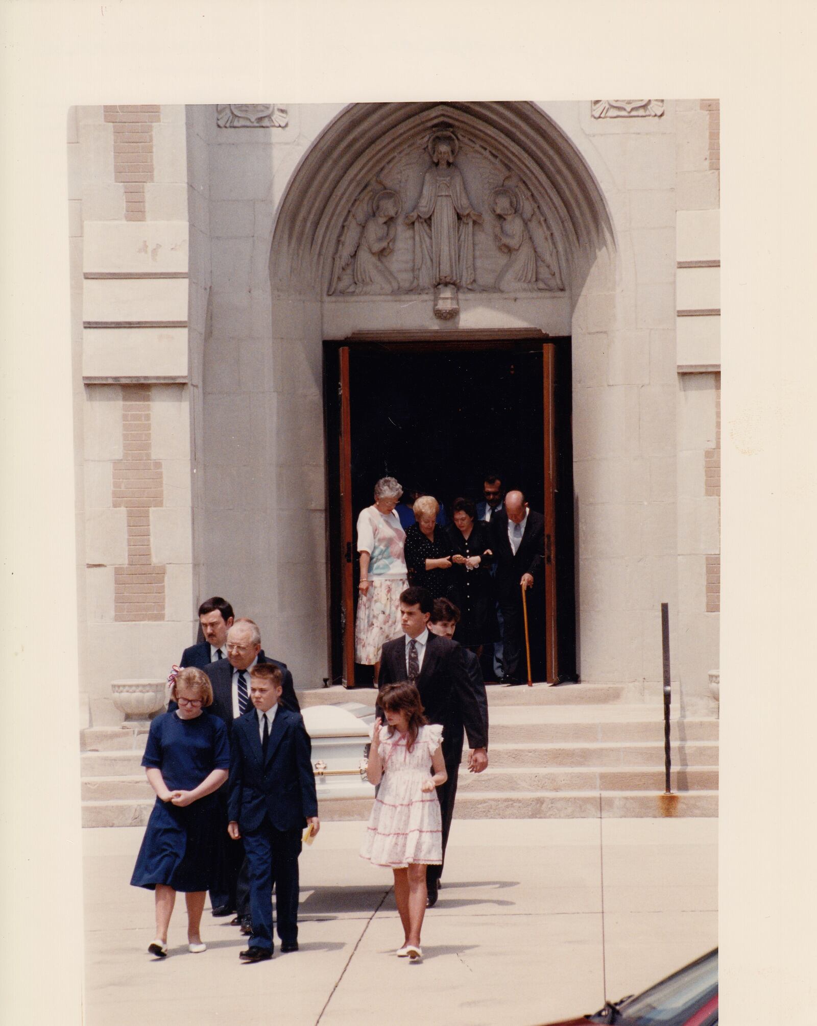 David E. Clark is serving a life sentence for the murder of Amanda Simpson. She was 12 when her house was set on fire. Clark was 15. This photo was taken outside of her funeral in 1991.