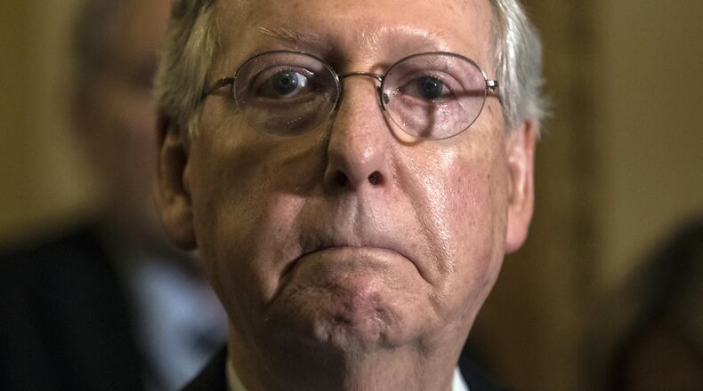 In this June 27, 2017, photo, Senate Majority Leader Mitch McConnell, R-Ky., tells reporters he is delaying a vote on the Republican health care bill at the Capitol in Washington. Congressional Republicans are stymied over health care. But after seven years of promising to repeal and replace former President Barack Obama’s law, they risk political disaster if they don’t deliver. (AP Photo/J. Scott Applewhite)