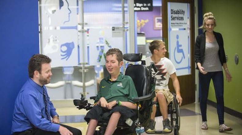 Wright State was recognized as one of the best universities in the nation for students with physical disabilities. Pictured are Tom Webb, left, director of disability services, and Dan Darkow, who graduated from Wright State in 2015. Photo Contributed.