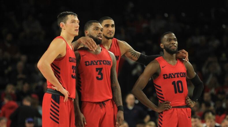 Dayton’s Ryan Mikesell, Trey Landers, Obi Toppin and Jalen Crutcher watch Ibi Watson shoot a free throw against Richmond on Saturday, Jan. 25, 2020, at the Robins Center in Richmond, Va. (Photo: David Jablonski/Dayton Daily News)